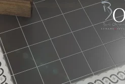 Carrelage Signature Carrelage imitant carreau ciment 20x20 cm décor Angle Noir / Blanc / Gris 11mm - vendu par boite de 1 m2 soit 25 carreaux -